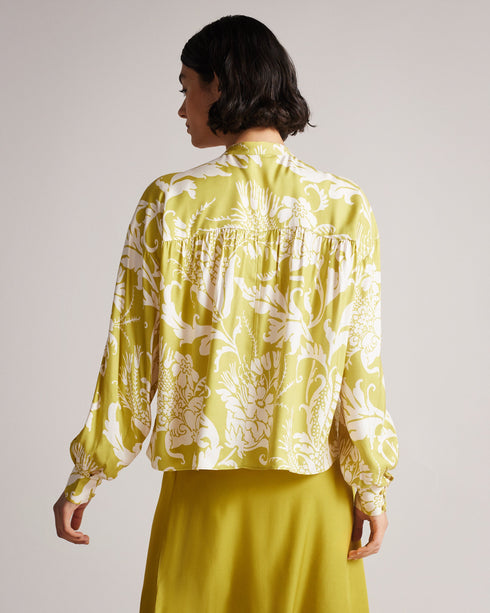 AYVERI-Tops-A gorgeous baroque printed blouse, AYVERI is ideal for a warm summer evening, or a lunchtime coffee date. This top features a gathered yoke for added interest and will look stunning with jeans or shorts and an elegant strappy heel. Blouse Baroque print Gathered yoke detail Long sleeved Button fastening Cropped boxy fit Wendy is 5'9.5" / 1.77m and wears Yellow in a Ted size 1- Ted Baker Romania
